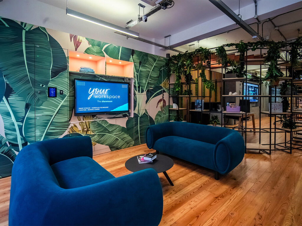Blue sofas and botanical decor displayed at the new Your Workspace London showroom.