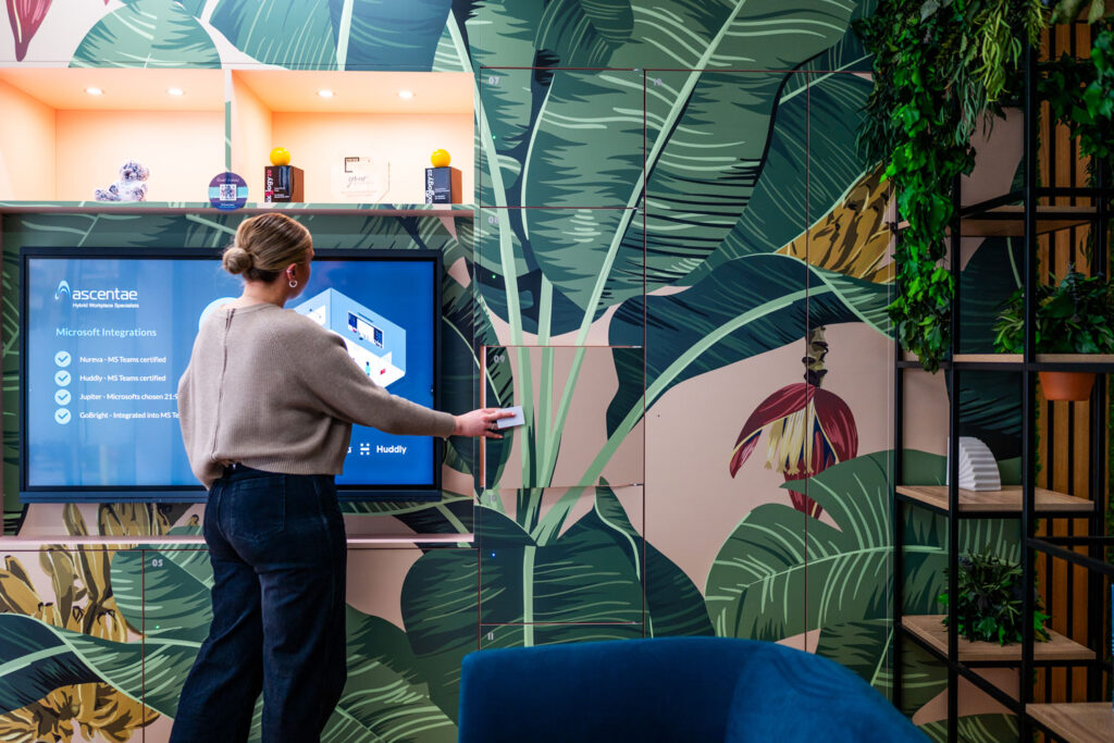 Person opening a Simplicity smart locker in the Your Workspace showroom.
