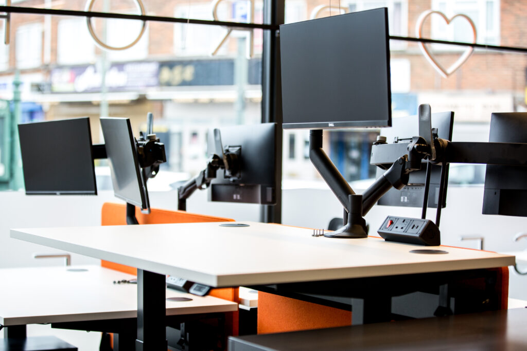 Sit stand desks in an office environment.