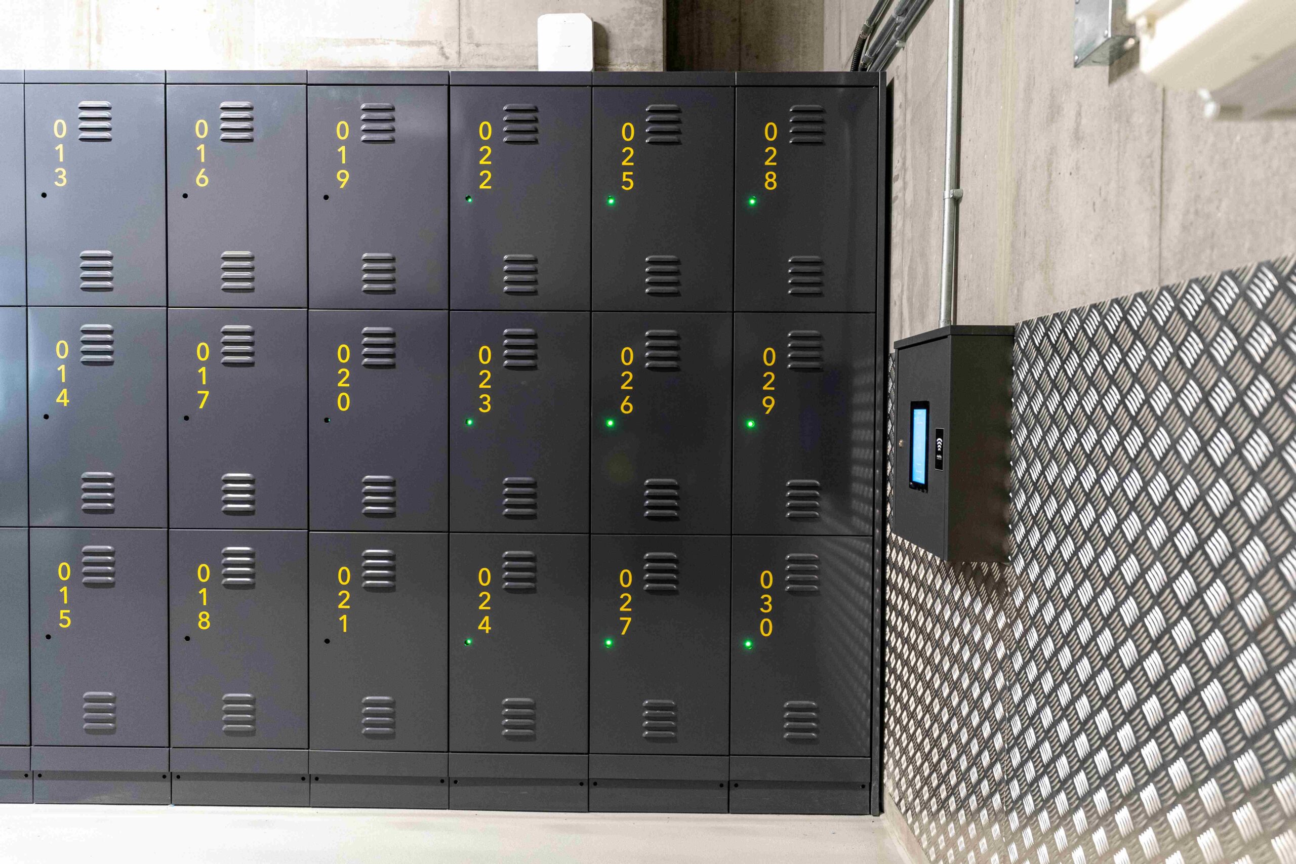 Metal bike lockers in the basement of Stratford Cross.