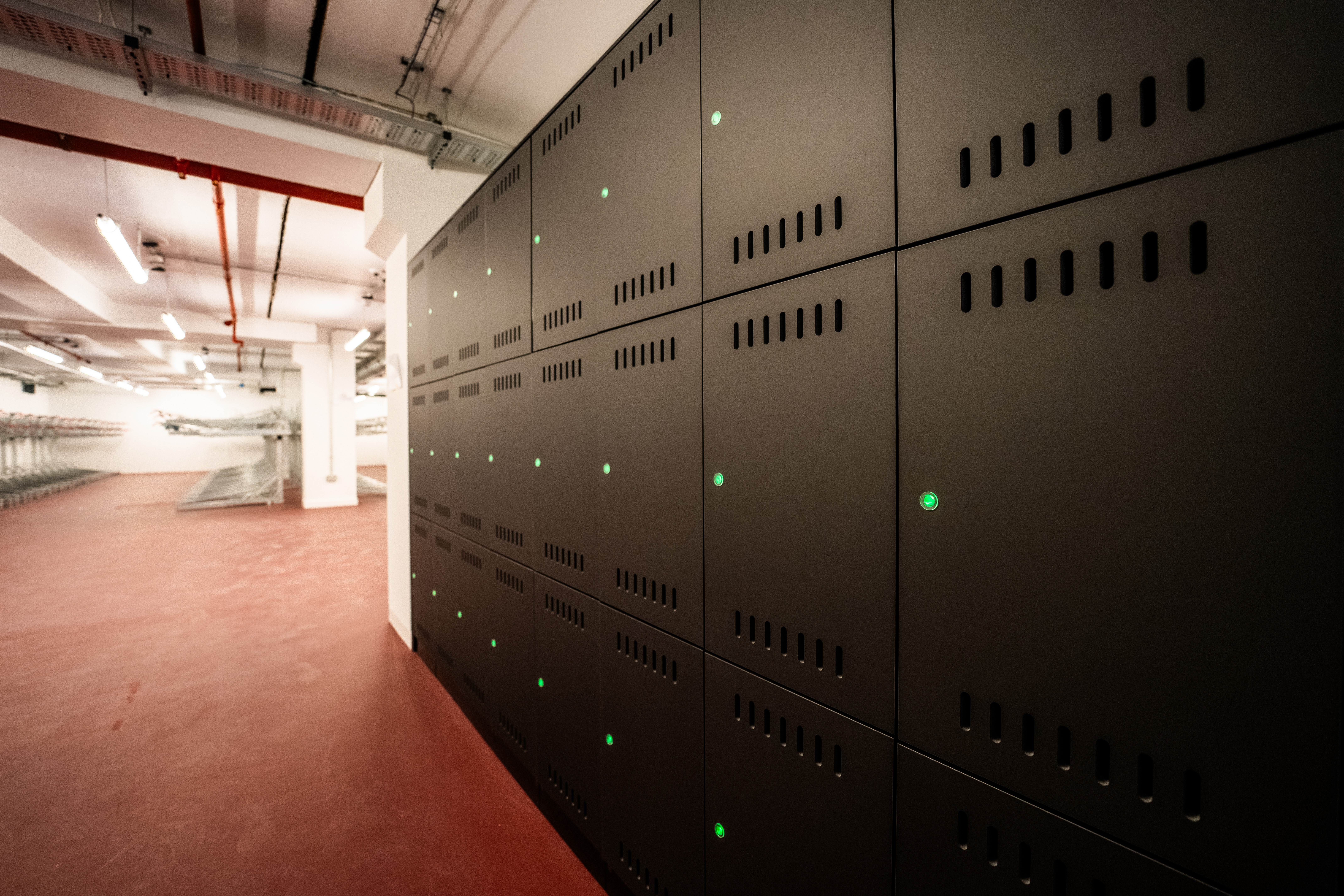 Folding bike lockers in the basement of Maple House.