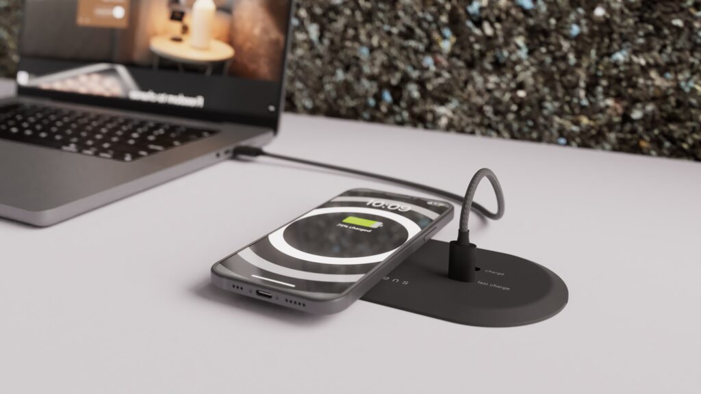 Charging a phone and laptop with the Your Workcharge Combi.