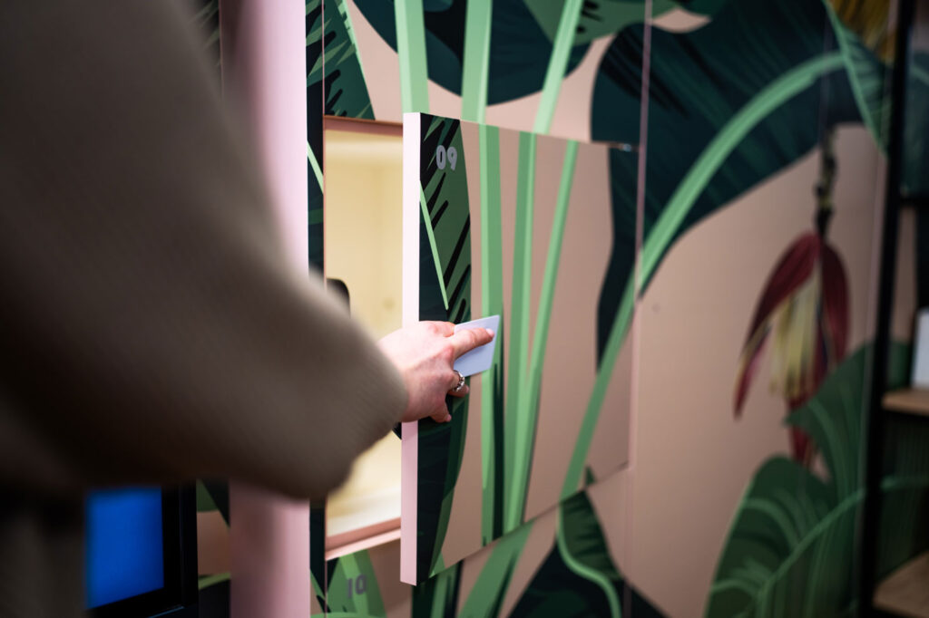 Person opening a Simplicity smart locker with an RFID card.